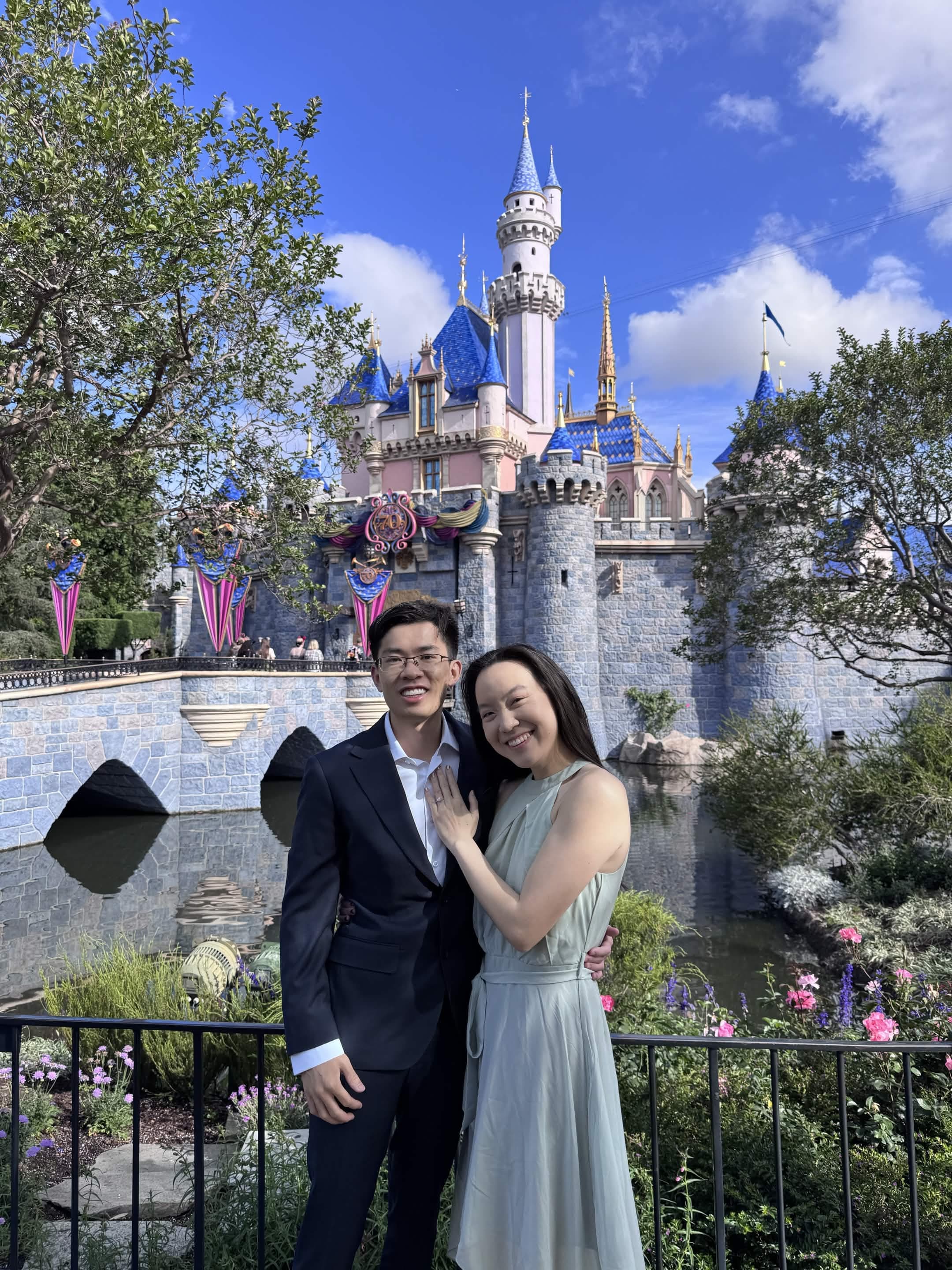 Courtney and Hank at Disneyland with the castle behind them